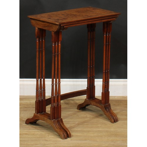 2125 - A George III Revival burr yew nest of three occasional tables, the tops outlined with boxwood string... 