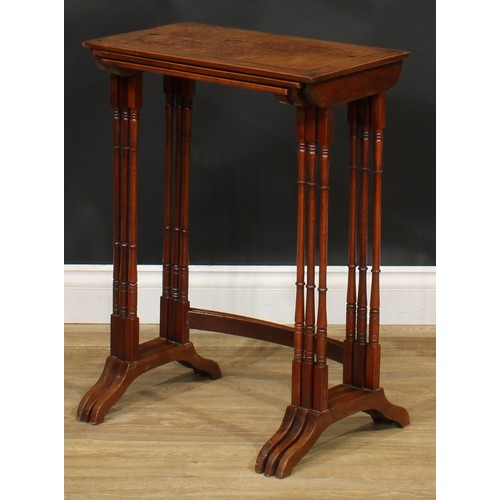 2125 - A George III Revival burr yew nest of three occasional tables, the tops outlined with boxwood string... 