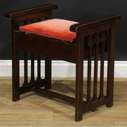 2652 - An Art Nouveau music stool, the sides with slats shaped as organic motifs, adjustable seat with bras... 