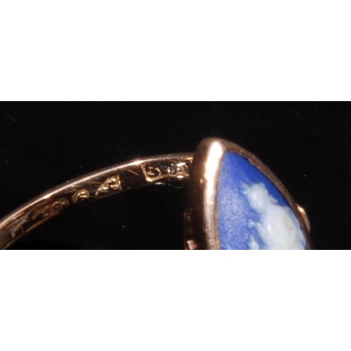 1323 - A 9ct gold and jasperware ring, the navette shaped tablet sprigged in the Grand Tour taste with Dian... 