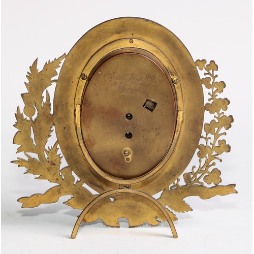 2382 - A Victorian gilt brass strut easel timepiece, by Howell James & Co, oval silvered clock dial inscrib... 