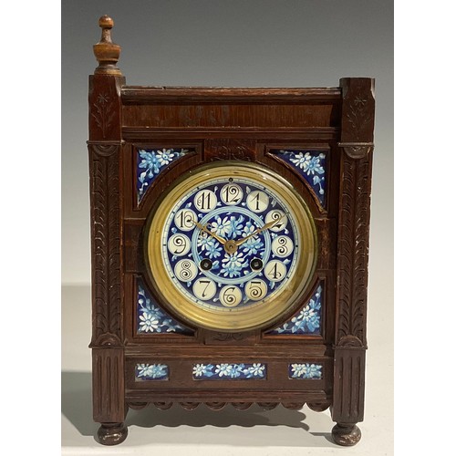 2383 - An Aesthetic Movement oak mantel clock, 10cm circular dial inscribed with Arabic numerals and painte... 