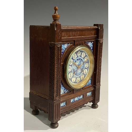 2383 - An Aesthetic Movement oak mantel clock, 10cm circular dial inscribed with Arabic numerals and painte... 