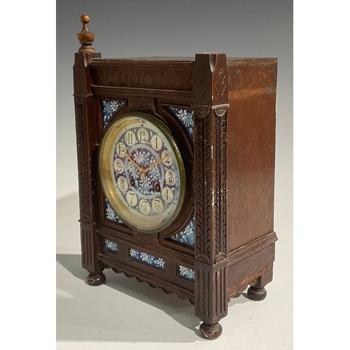 2383 - An Aesthetic Movement oak mantel clock, 10cm circular dial inscribed with Arabic numerals and painte... 