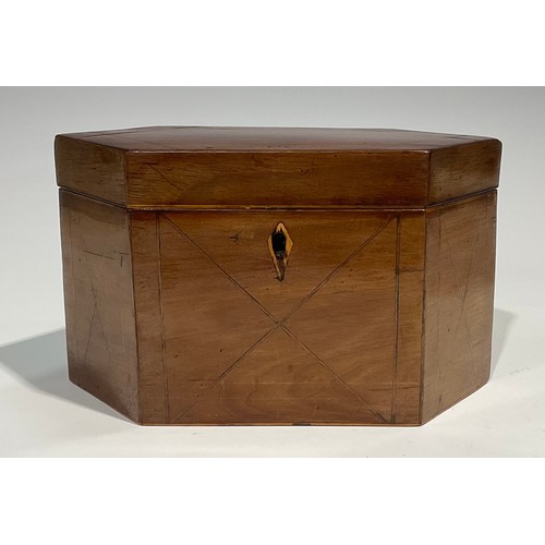 2459 - A George III mahogany lozenge shaped tea caddy, hinged cover enclosing a pair of lidded compartments... 