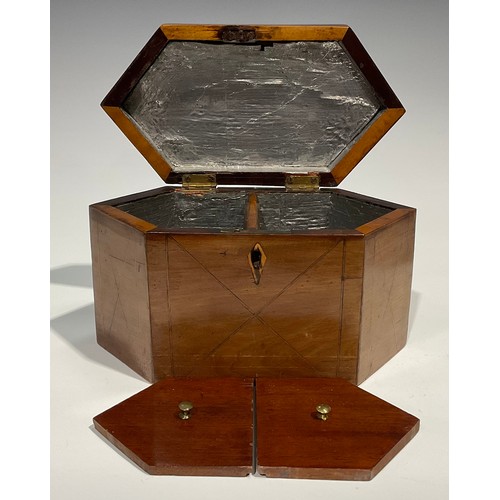 2459 - A George III mahogany lozenge shaped tea caddy, hinged cover enclosing a pair of lidded compartments... 