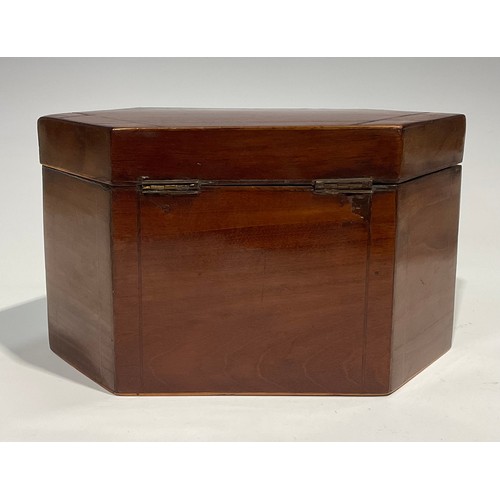 2459 - A George III mahogany lozenge shaped tea caddy, hinged cover enclosing a pair of lidded compartments... 