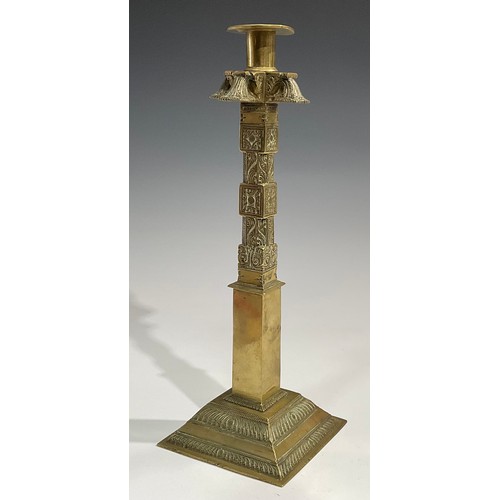 2089 - A pair of large 19th century Indian gilt brass candlesticks, cast and chased with stylised lotus and... 