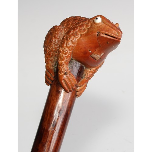 2672 - An early 20th century novelty walking stick, the boxwood pommel carved as Jin Chan, the Chinese mone... 