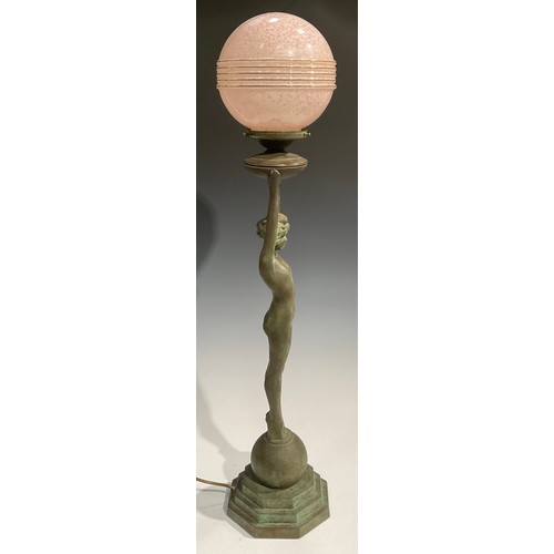 2646 - An Art Deco style copper figural table lamp, as a female nude, glass globular shade, stepped octagon... 