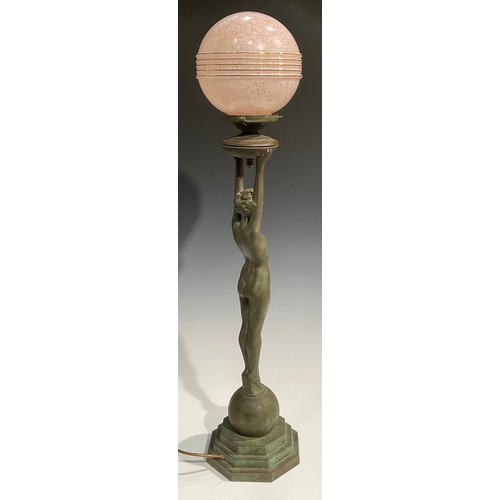 2646 - An Art Deco style copper figural table lamp, as a female nude, glass globular shade, stepped octagon... 