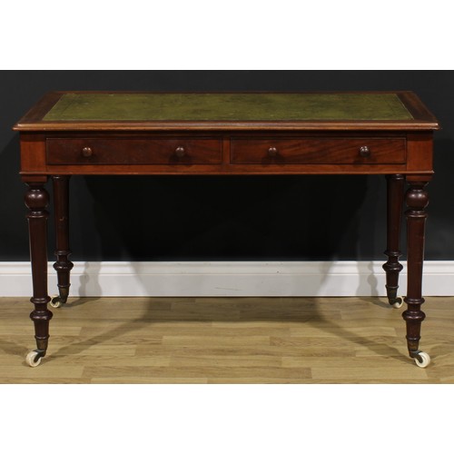 2590 - A Victorian mahogany writing table, rectangular top with inset tooled and gilt writing surface, abov... 