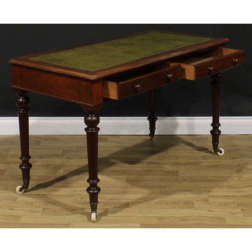 2590 - A Victorian mahogany writing table, rectangular top with inset tooled and gilt writing surface, abov... 