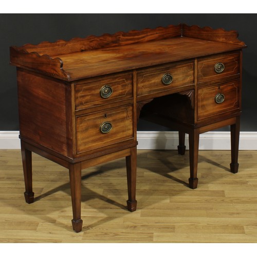 1701 - A 19th century mahogany sideboard or serving table, of unusually small proportions, wavy three-quart... 