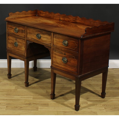 1701 - A 19th century mahogany sideboard or serving table, of unusually small proportions, wavy three-quart... 