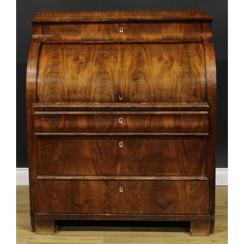 1577 - A 19th century Biedermeier flame mahogany cylinder desk, concave frieze drawer above a retractable f... 