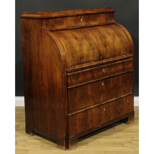 1577 - A 19th century Biedermeier flame mahogany cylinder desk, concave frieze drawer above a retractable f... 