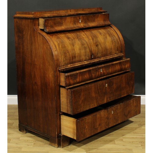 1577 - A 19th century Biedermeier flame mahogany cylinder desk, concave frieze drawer above a retractable f... 