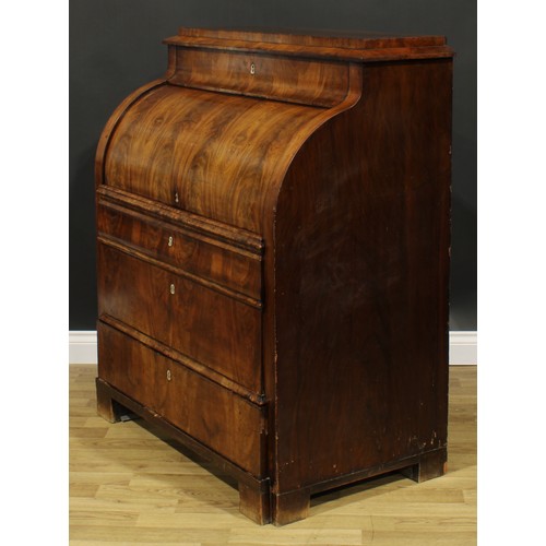 1577 - A 19th century Biedermeier flame mahogany cylinder desk, concave frieze drawer above a retractable f... 