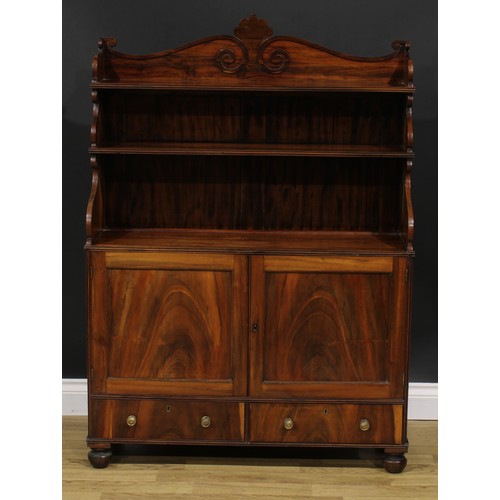 1985 - A Post-Regency waterfall library bookcase cabinet, three-quarter gallery carved with scrolls, the pr... 