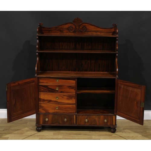 1985 - A Post-Regency waterfall library bookcase cabinet, three-quarter gallery carved with scrolls, the pr... 