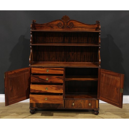 1985 - A Post-Regency waterfall library bookcase cabinet, three-quarter gallery carved with scrolls, the pr... 