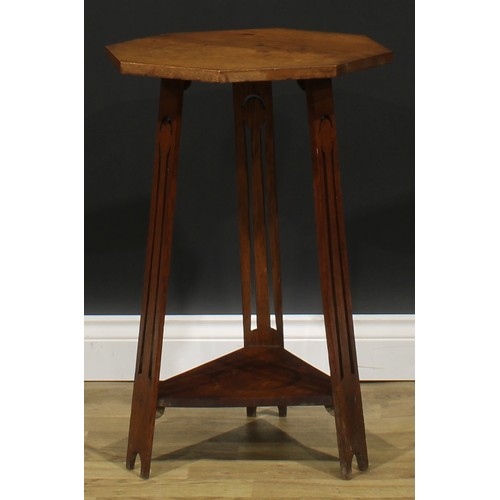 2656 - An Arts & Crafts oak occasional table, in the manner of Liberty & Co, octagonal top, outswept legs p... 