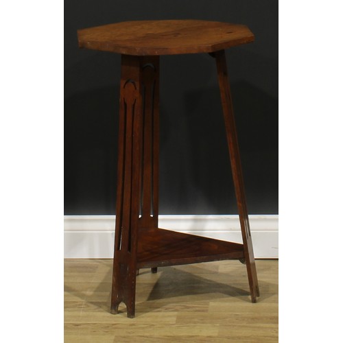 2656 - An Arts & Crafts oak occasional table, in the manner of Liberty & Co, octagonal top, outswept legs p... 