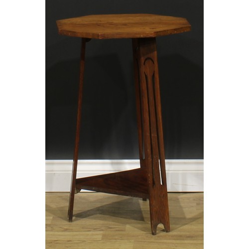 2656 - An Arts & Crafts oak occasional table, in the manner of Liberty & Co, octagonal top, outswept legs p... 