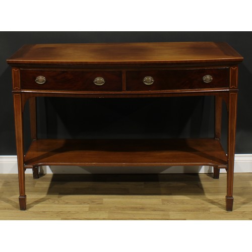 2128 - A George III Revival mahogany bowfront serving or side table, oversailing top above a pair of frieze... 