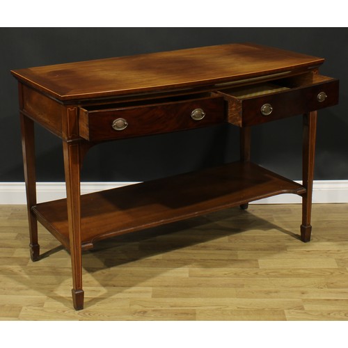 2128 - A George III Revival mahogany bowfront serving or side table, oversailing top above a pair of frieze... 