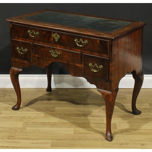 1727 - A George I walnut lowboy, crossbanded top now as a desk with inset tooled and gilt writing surface, ... 