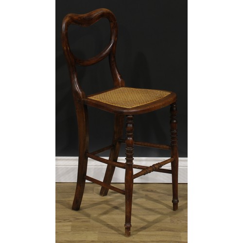 2683 - An early Victorian faux-rosewood music room chair, kidney shaped back, cane seat, turned legs and st... 