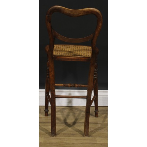 2683 - An early Victorian faux-rosewood music room chair, kidney shaped back, cane seat, turned legs and st... 