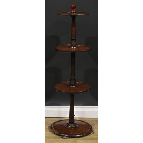 1626 - A 19th century mahogany circular four-tier dumbwaiter, dished plateaux, bun feet, 122cm high, the la... 