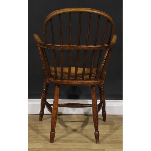 1574 - A 19th century ash and elm Windsor elbow chair, low hoop back, saddle seat, H-stretcher, 95cm high, ... 