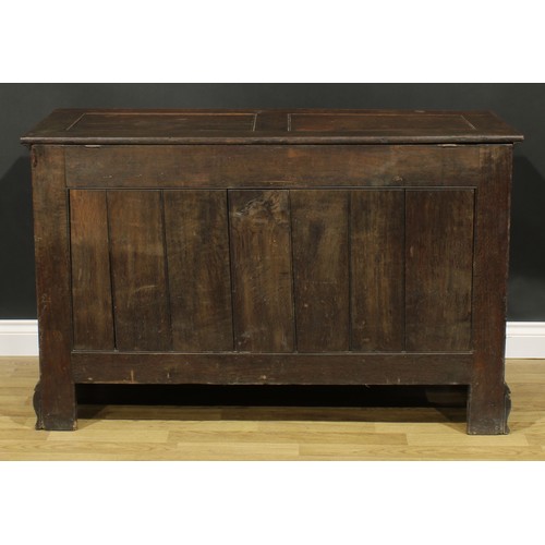 1947 - A George III oak mule chest, hinged two panel top, above a long drawer, skirted base, ogee bracket f... 