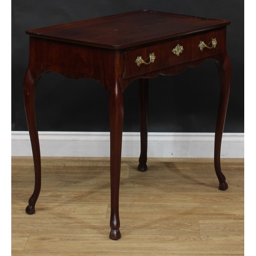 1702 - A 19th century mahogany silver table, dished rectangular top above a long frieze drawer, shaped apro... 