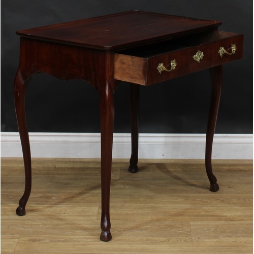 1702 - A 19th century mahogany silver table, dished rectangular top above a long frieze drawer, shaped apro... 