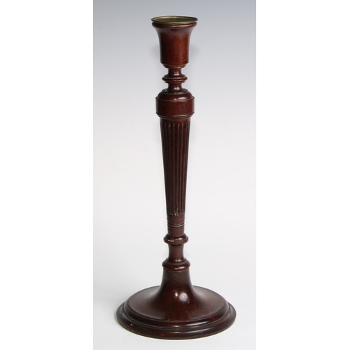 1822 - A pair of Adam Revival mahogany table candlesticks, bell shaped sconces with brass nozzles, tapered ... 