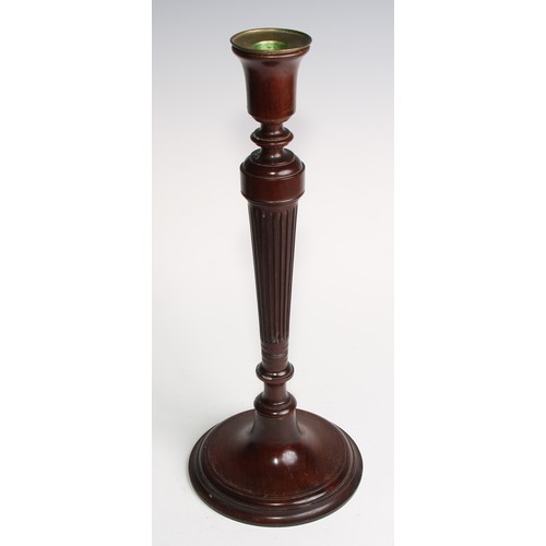 1822 - A pair of Adam Revival mahogany table candlesticks, bell shaped sconces with brass nozzles, tapered ... 