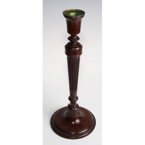 1822 - A pair of Adam Revival mahogany table candlesticks, bell shaped sconces with brass nozzles, tapered ... 