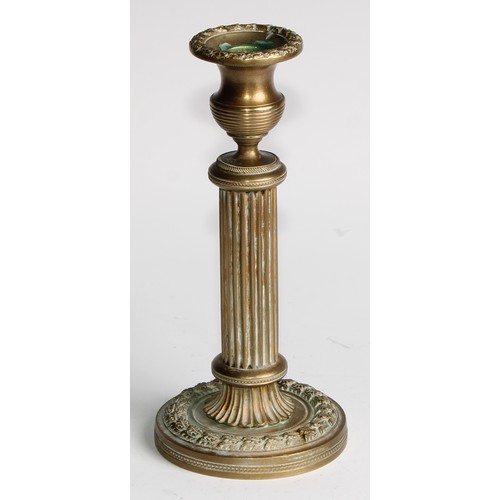 1817 - A pair of 19th century gilt bronze candlesticks, campana sconces, fluted pillars, acanthus borders, ... 