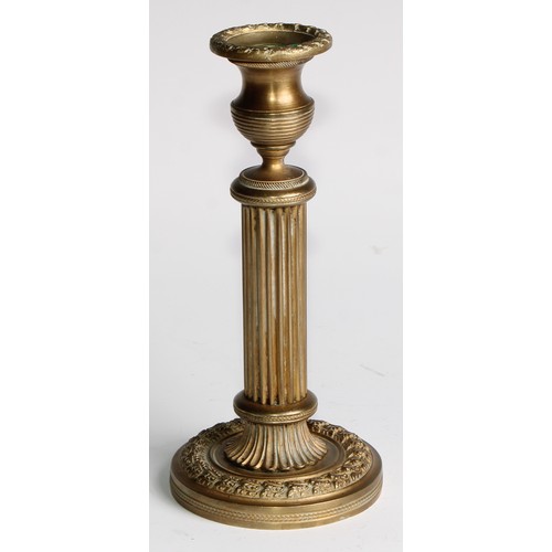 1817 - A pair of 19th century gilt bronze candlesticks, campana sconces, fluted pillars, acanthus borders, ... 