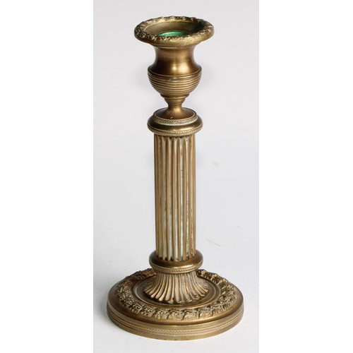 1817 - A pair of 19th century gilt bronze candlesticks, campana sconces, fluted pillars, acanthus borders, ... 