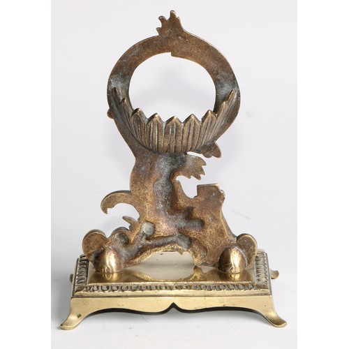 1555 - A 19th century brass pocket watch stand, cast in the Rococo taste with a figure reading, 17cm high, ... 