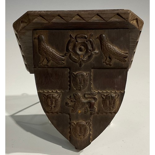 1820 - A pair of 19th century Gothic Revival oak armorial wall brackets, carved with the coats of arms of C... 