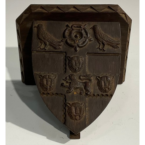 1820 - A pair of 19th century Gothic Revival oak armorial wall brackets, carved with the coats of arms of C... 