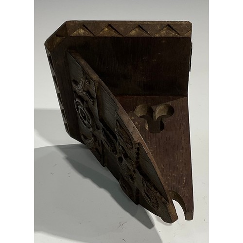 1820 - A pair of 19th century Gothic Revival oak armorial wall brackets, carved with the coats of arms of C... 