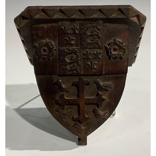 1820 - A pair of 19th century Gothic Revival oak armorial wall brackets, carved with the coats of arms of C... 